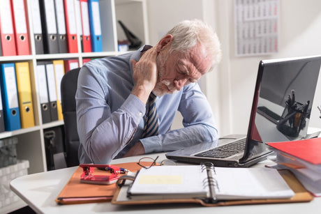 older man experiencing old age pains and aches